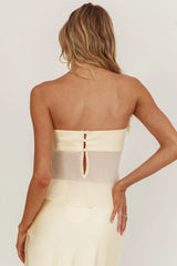 Top Jerica sin tirantes con cintura transparente color mantequilla