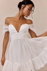 Minivestido Pixi blanco con espalda cruzada y hombros descubiertos