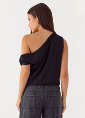 Top con diseño "Stick Around" - Negro