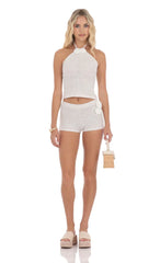 Pantalones cortos de ganchillo con rosetas en blanco