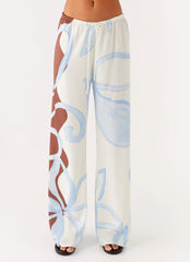 Pantalones Deacon de tiro bajo - Estampado Bloom Wave